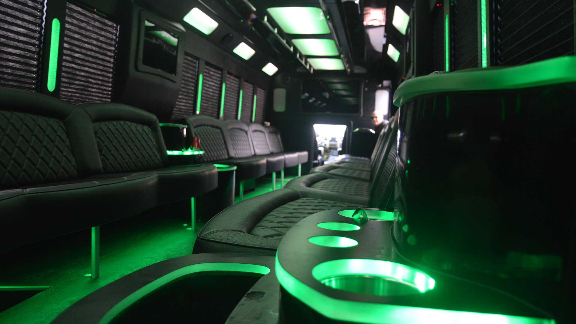 Party bus cabin with green interior lights on