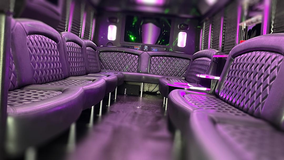 Purple lounge seating inside a Chicago party bus